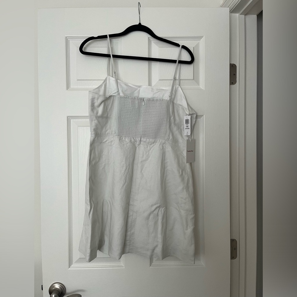 Never worn and too big. Color is called slate white.